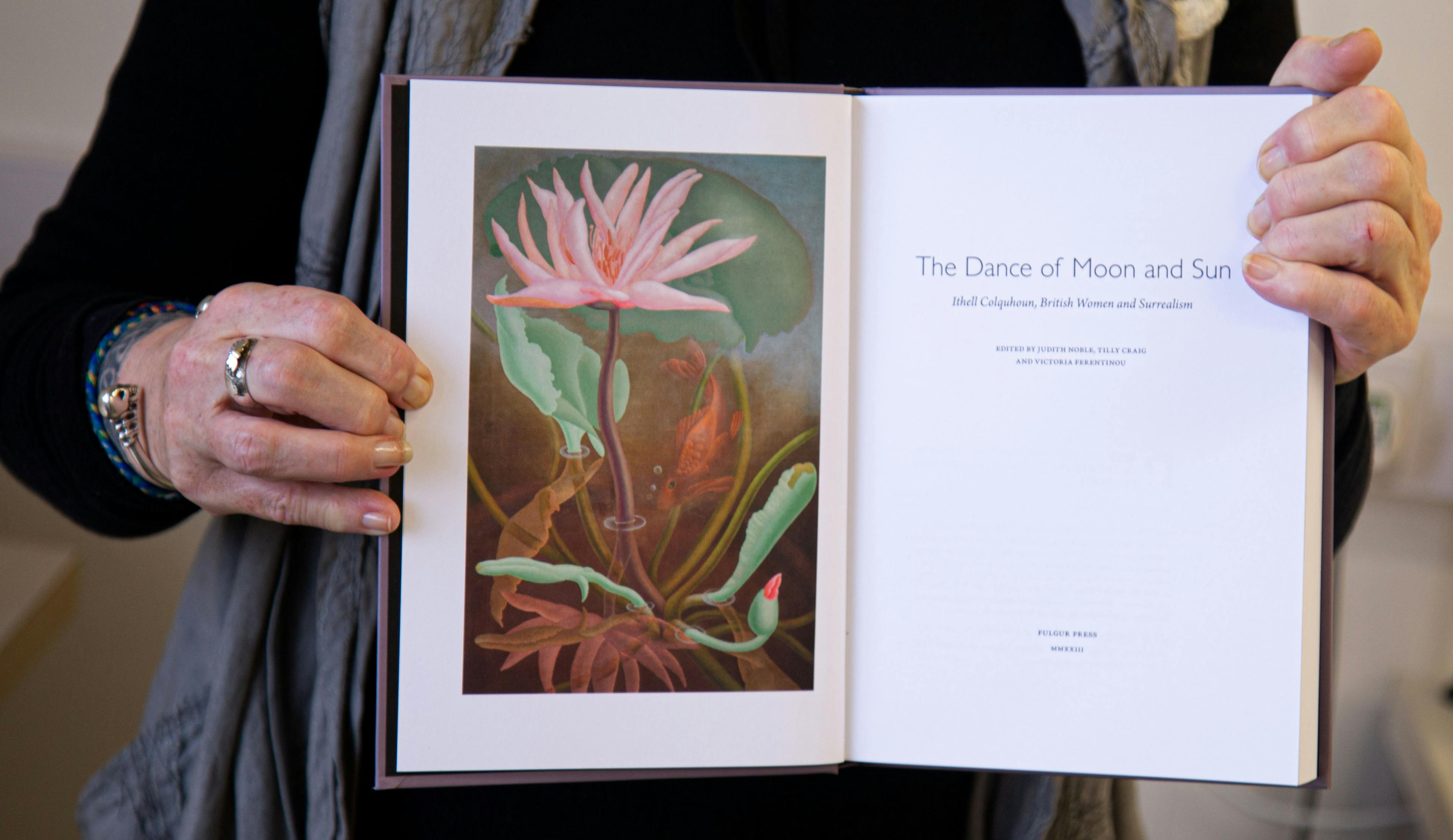 Judith Noble holding copy of The Dance of Moon and Sun