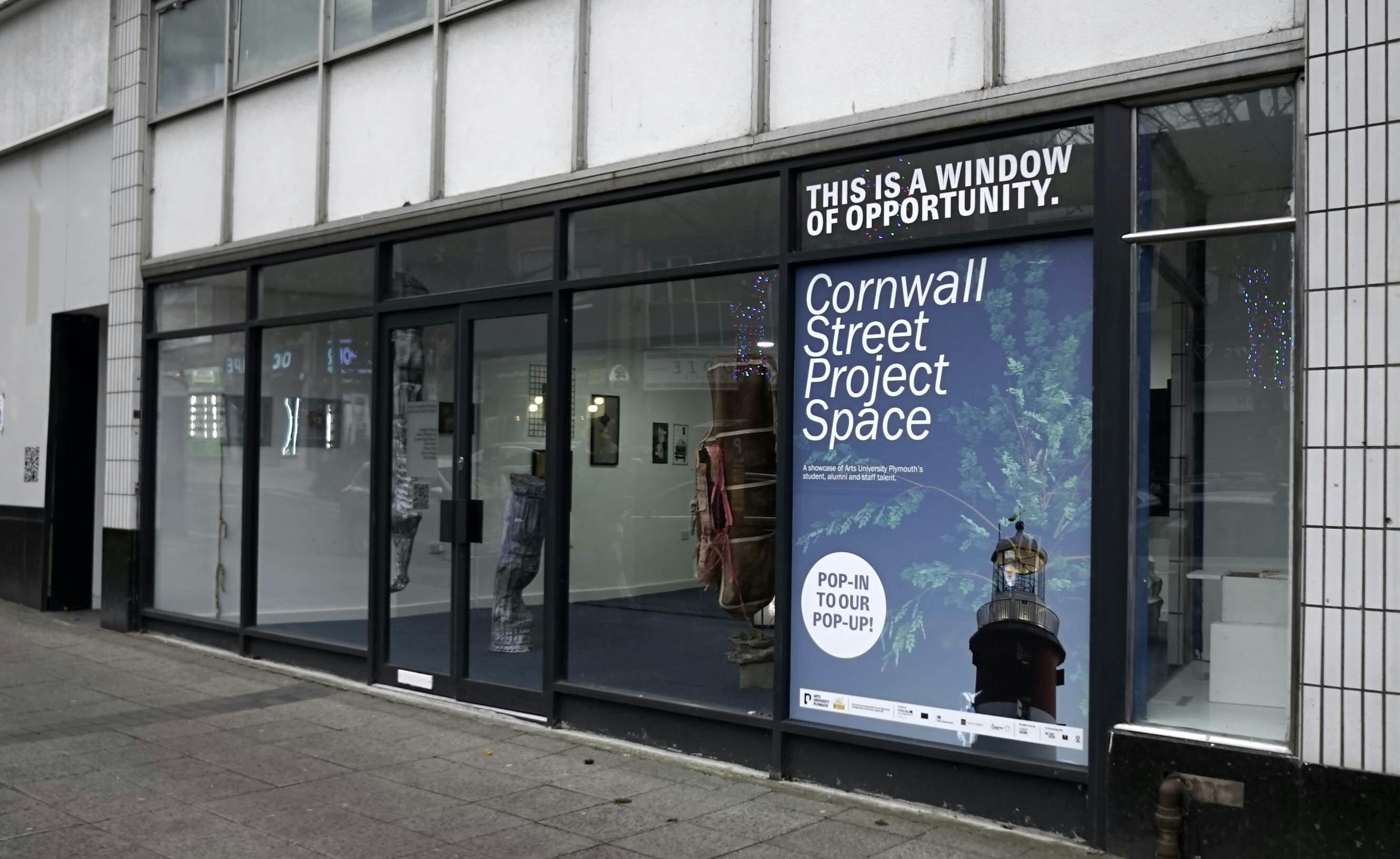 An image of a vacant shop front being used as an exhibition space on Cornwall Street in Plymouth city centre