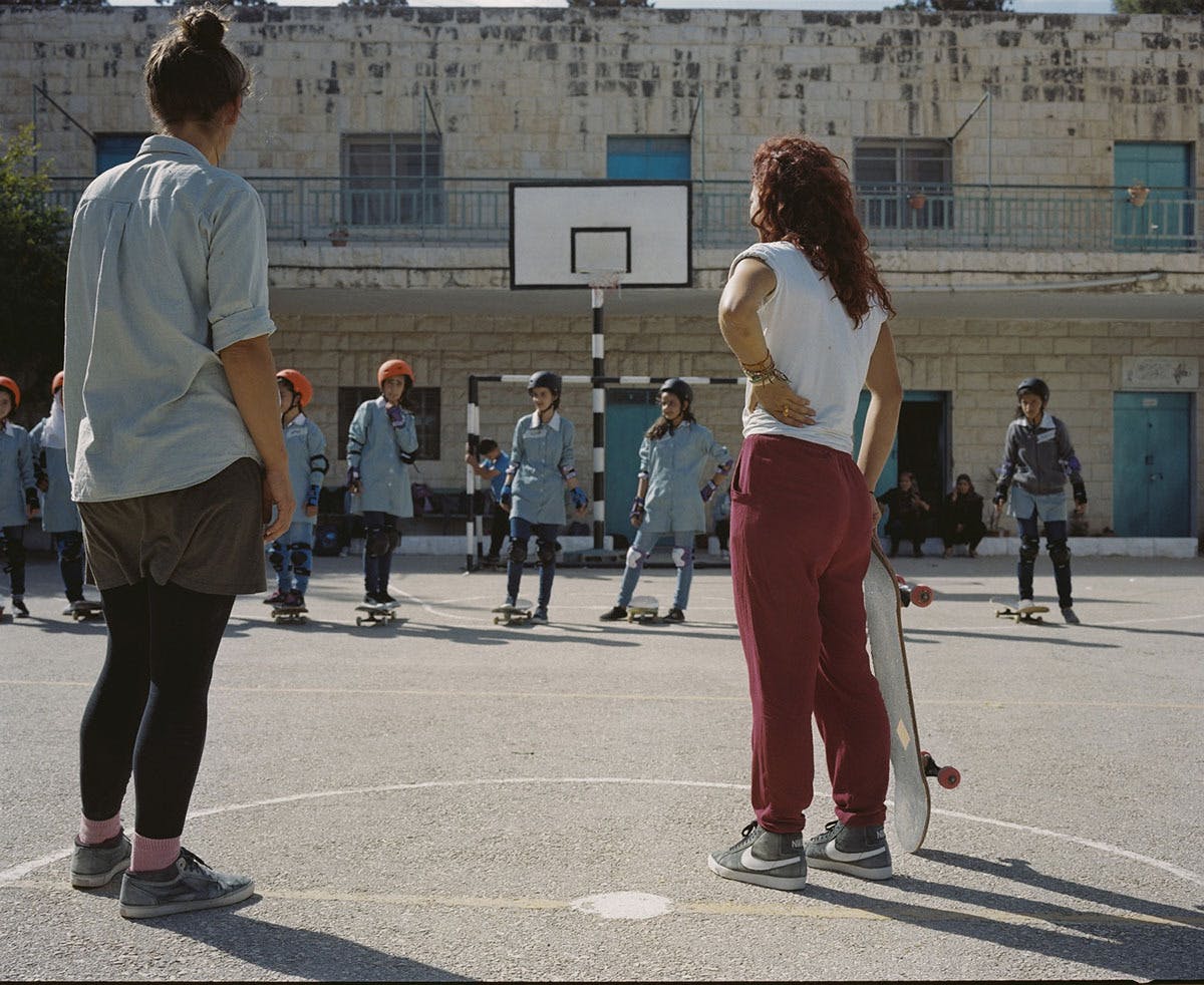 Artist Dani Abulhawa teaching young people to skate on the West Bank of Palestine Photo by Christan Nilsen