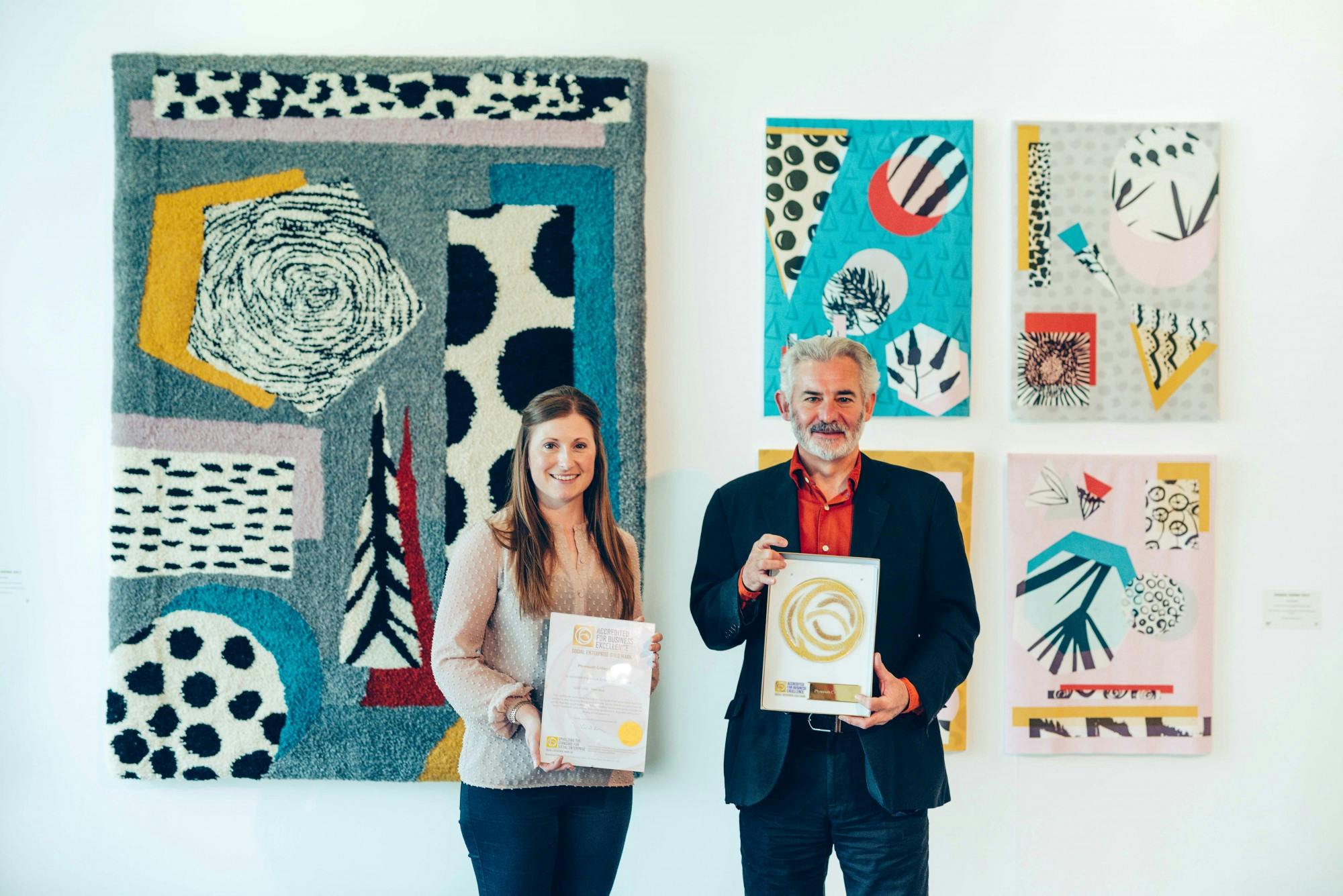 Hannah Harris Director of Development and Professor Andrew Brewerton Principal and Chief Executive of Plymouth College of Art with the Social Enterprise Gold Mark award