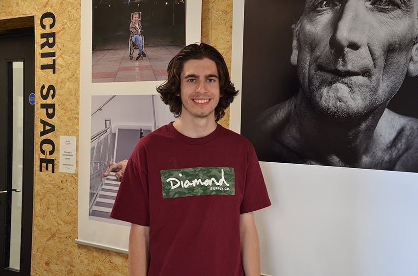 Jordan Mortlock with his photography at Plymouth College of Arts Palace Court campus copy