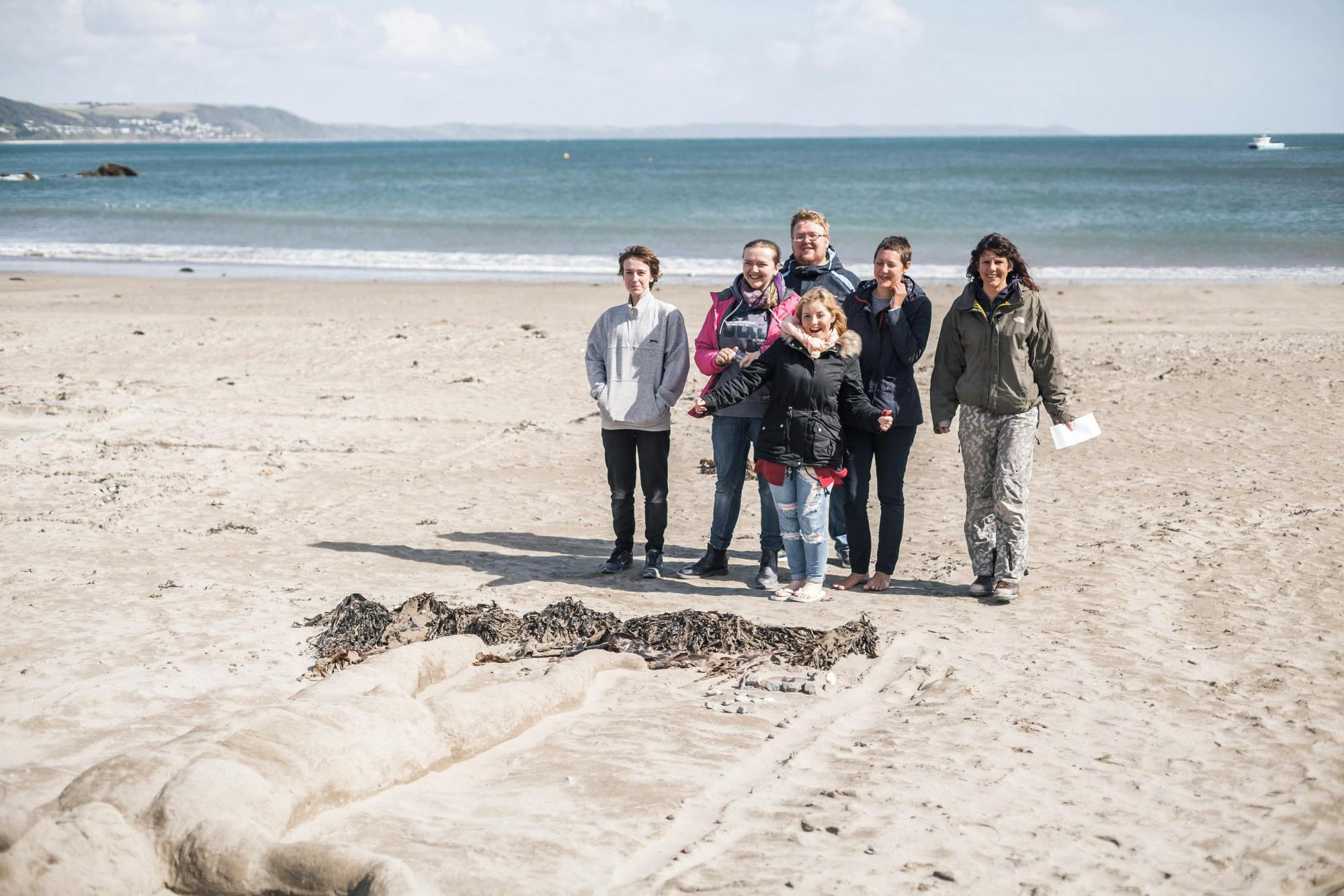 BA Hons Extended Degree students from Plymouth College of Art with their sand sculptures on Looe beach Photo by Taylor Harford