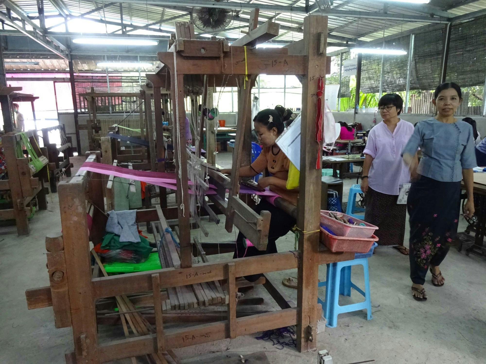 Students learn to weave at a vocational weaving school